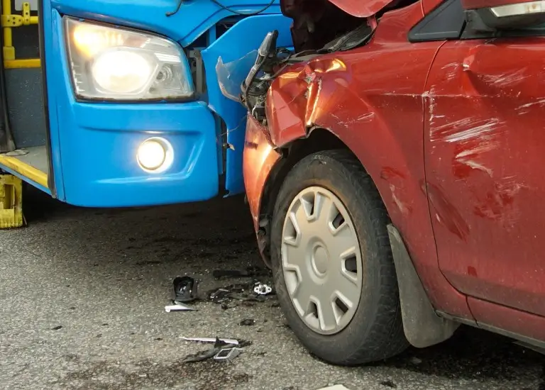a car that has crashed into a bus