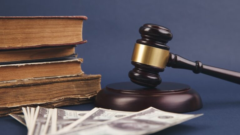 Judge wooden gavel with dollar money banknote