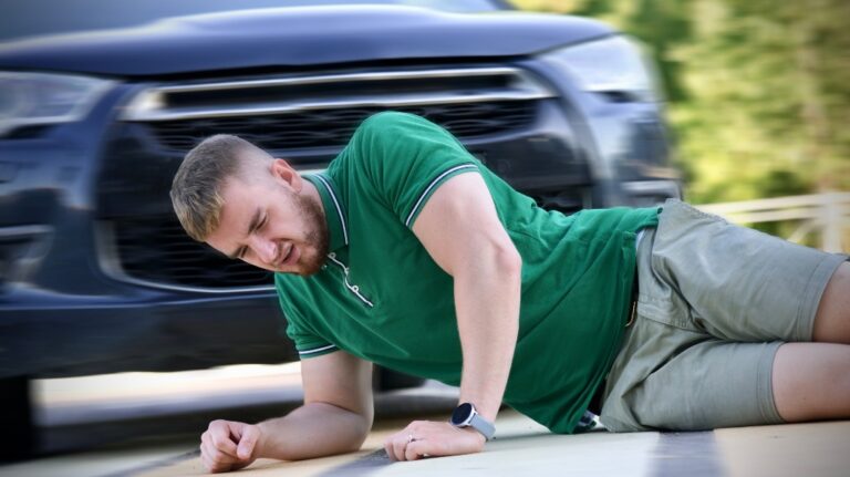 Young downed man at accident scene