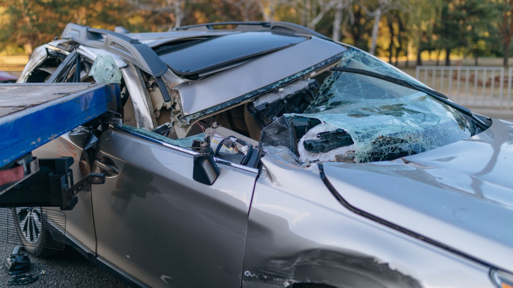 the car flew under the trailer of a truck