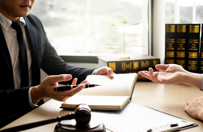 lawyer speaks with client