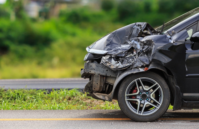 The front of the black car was damaged in the accident