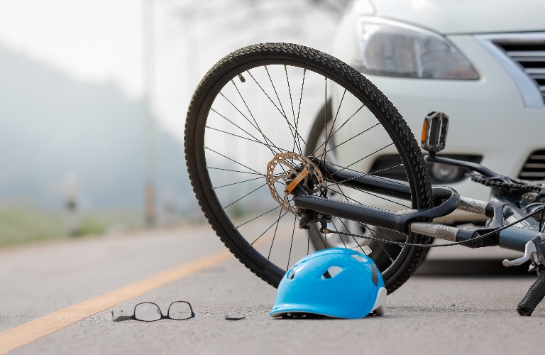 Accident car crash with bicycle on road