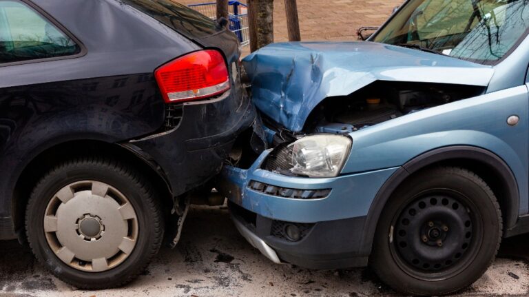 Two cars with metal damage after a rear-end collision
