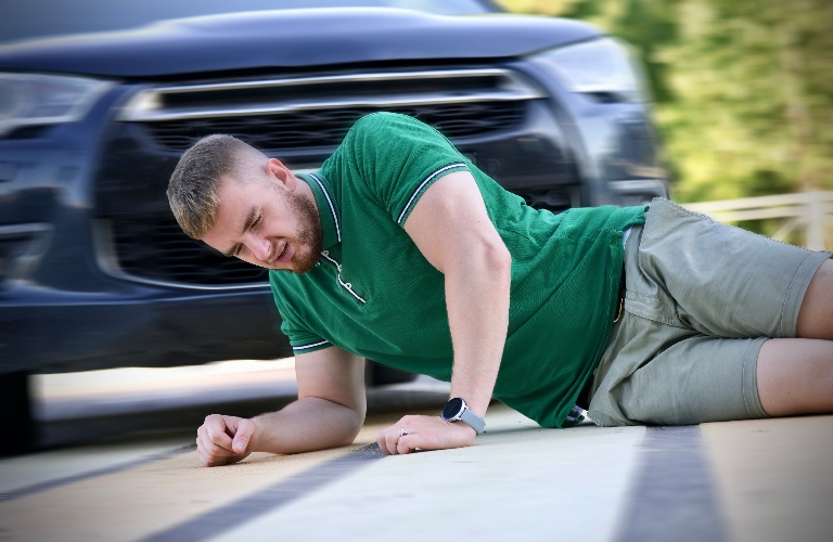 Young downed man at accident scene