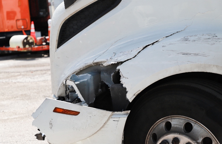 damaged white truck