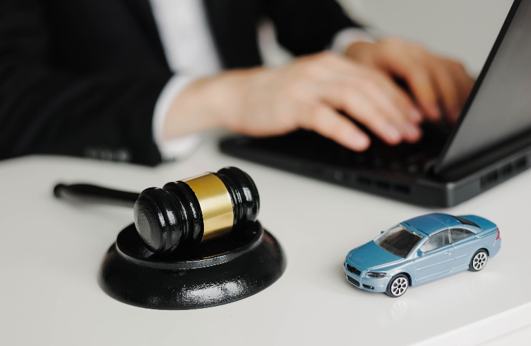 Judge's gavel and car model