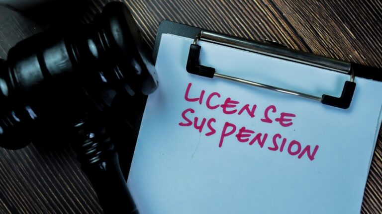 License Suspension is written on the paper and judge's gavel