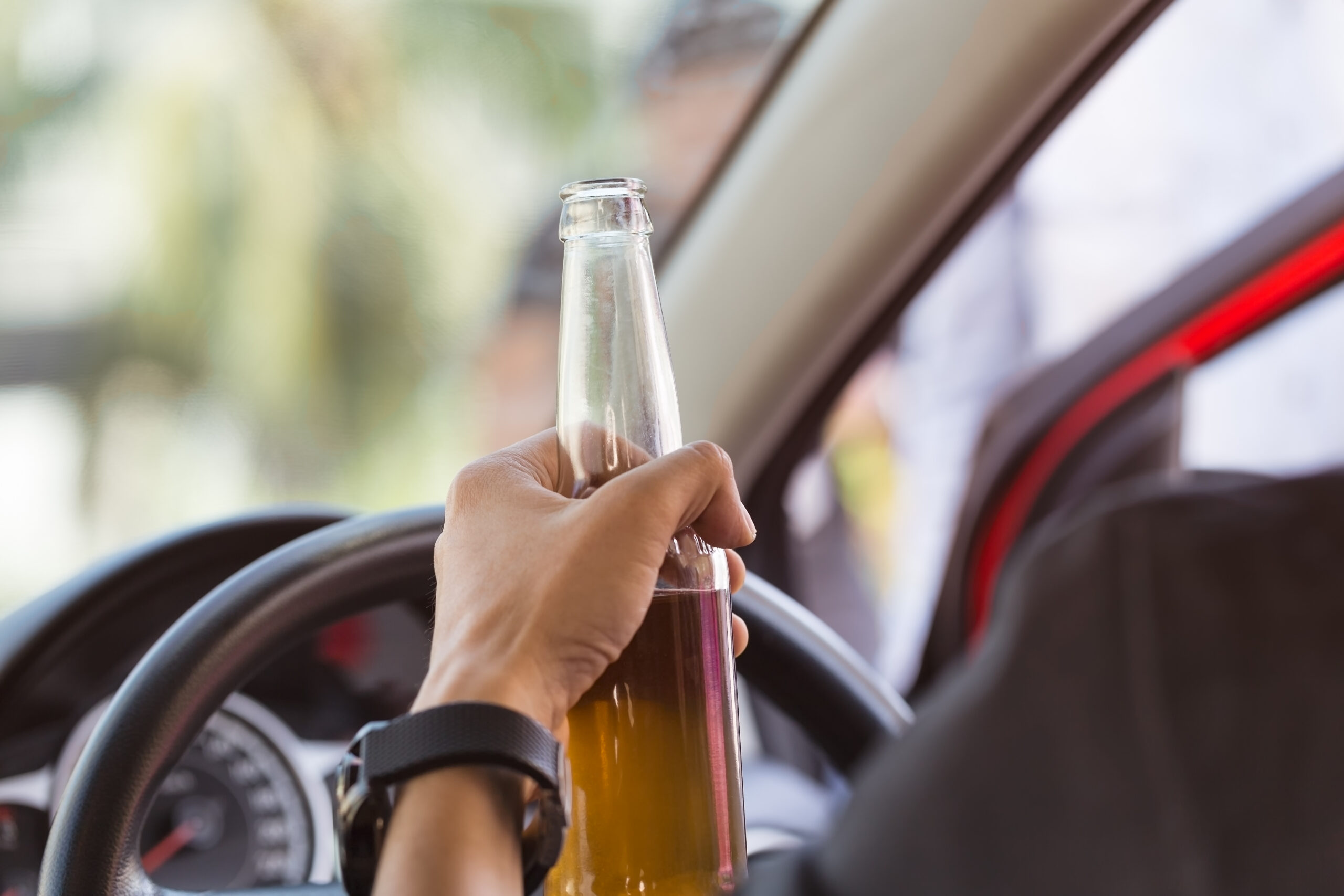 Close,Up,Of,Man,Hand,Holding,A,Bottle,Which,Driver