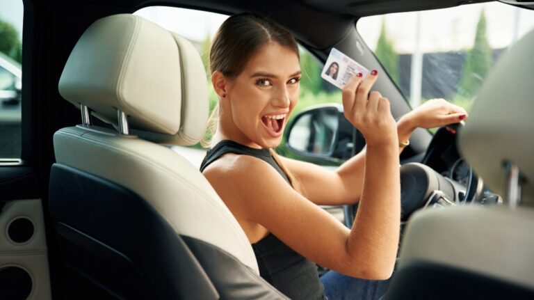 Got driver's license, Woman is sitting in the car
